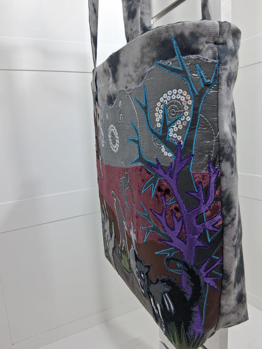 Side view of Halloween tote showing stitched trees and sequin details