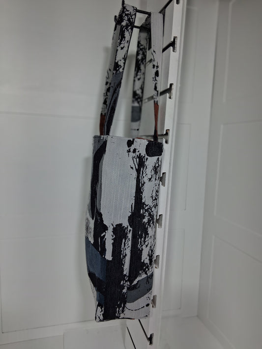 Side: "Side view of Pinpins Designs abstract tapestry tote bag showing structured depth and long shoulder handles"