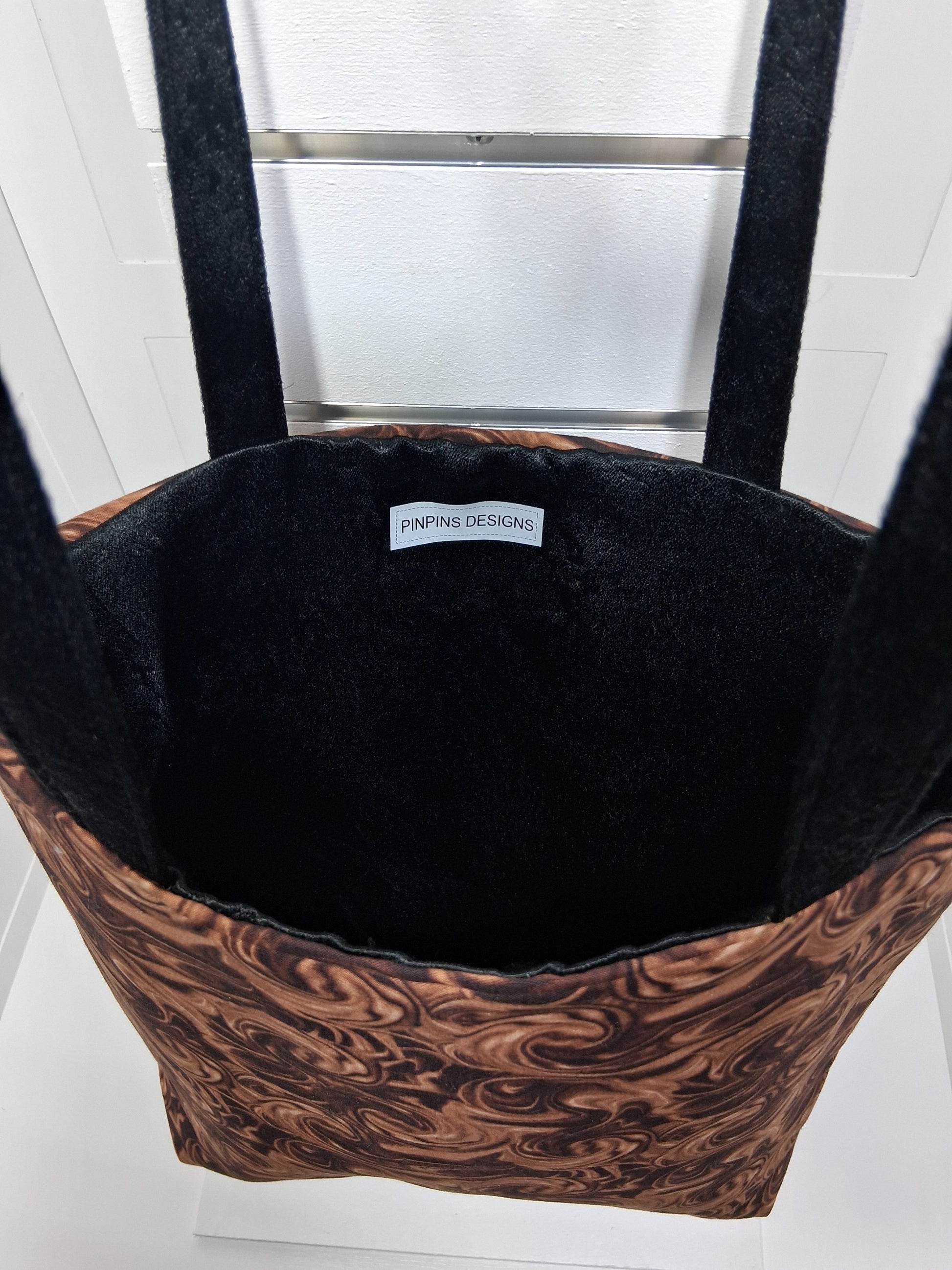  "Pinpins Designs handmade tote bag – interior view showing black lining and Pinpins Designs brand label"