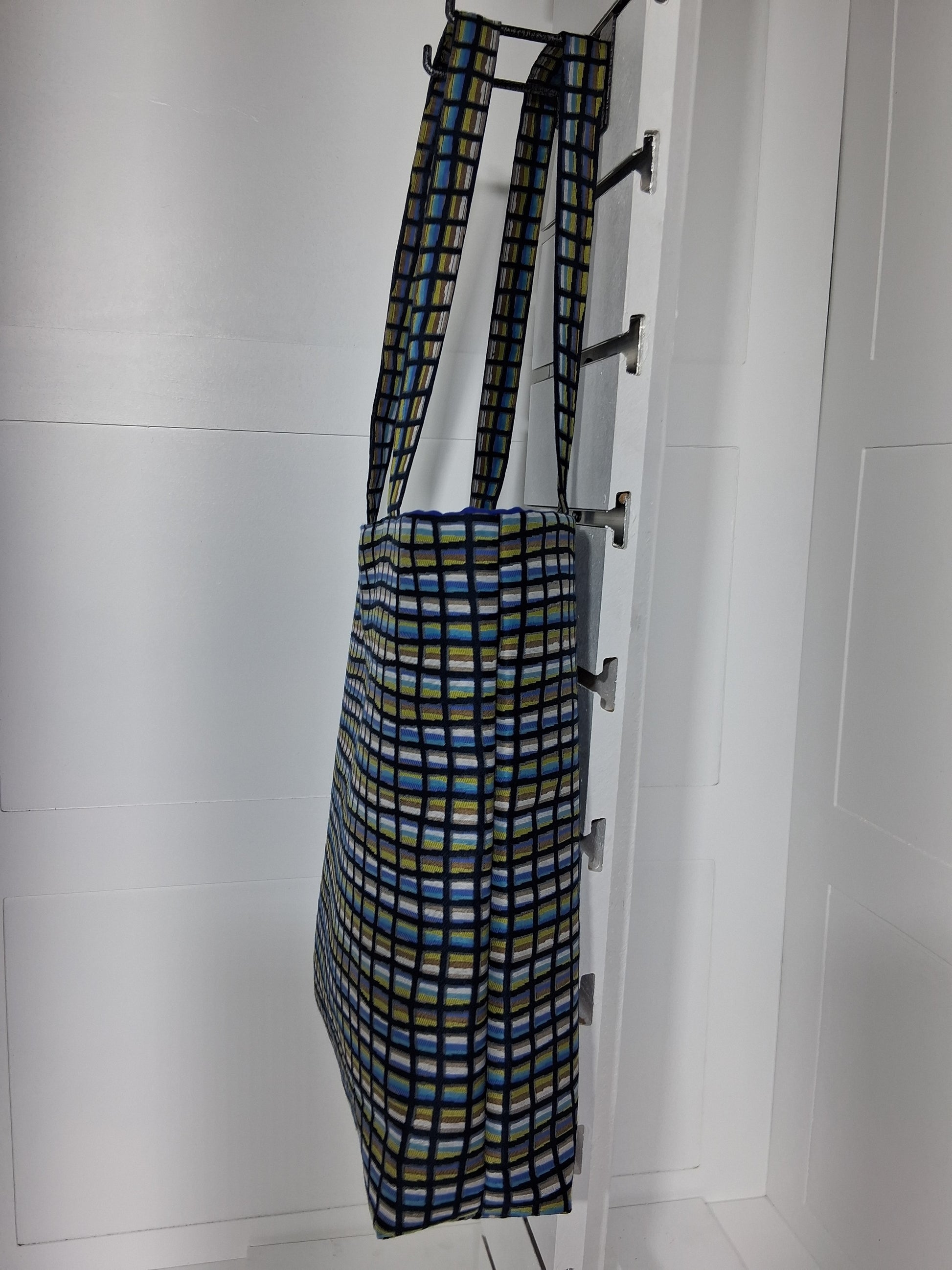 Pinpins Designs handmade tote bag- side view, blue and green geometric grid fabric with royal blue lining.