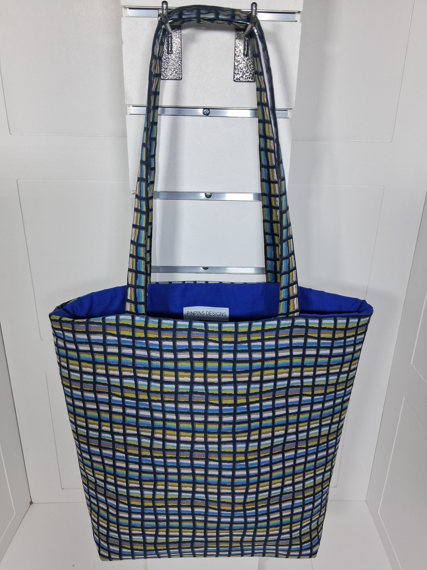  "Pinpins Designs handmade tote bag – front view, blue and green geometric grid fabric with royal blue lining"
